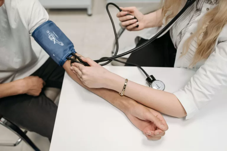 Medical students attending a practical training session, guided by an instructor in a clinical setting – ideal for Medical Course promotions.